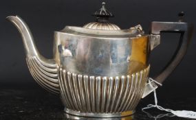 An Edwardian silver hallmarked teapot bearing marks for Birmingham 1908 by Williams Ltd. Weight 246.