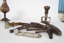 A collection of vintage piano tuning keys together with an unusual brass optical instrument ( see
