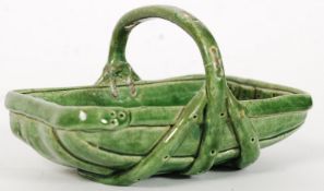 A vintage Rye Pottery Hop Ware ' Trug ' in green glaze being marked to the base