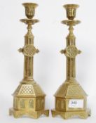 A good pair of gothic brass candlesticks  bearing Depose markings to the base