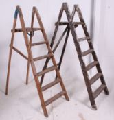 A pair of vintage Industrial decorators wooden step ladders ( see illustration )