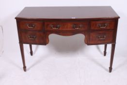 A 19th century Georgian bow front mahogany writing table desk.