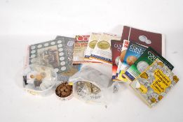 A mixed assortment of British coins along with coin collecting books