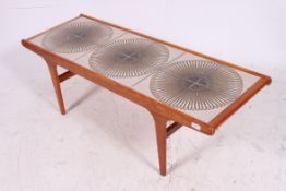 A good retro 1970's teak and tile top coffee table of rectangular form.