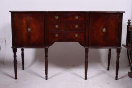 A Regency style mahogany sideboard raised on turned legs with cupboards and drawers together with a