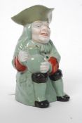 A 19th century Staffordshire green glaze toby jug - Unsigned