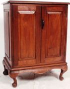 An early 20th century teak / mahogany anglo Indian side cabinet raised on.