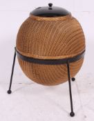 A Lloyd Loom Sputnik wicker linen basket, designed by Geoffrey Lusty,