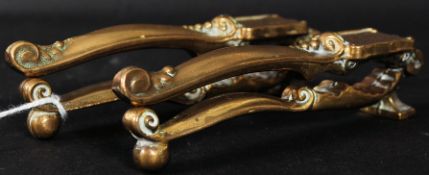2 pairs of decorative brass nut crackers.