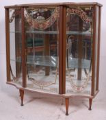 A vintage 20th century retro faux rosewood formica 1960's glass display cabinet raised on tapered