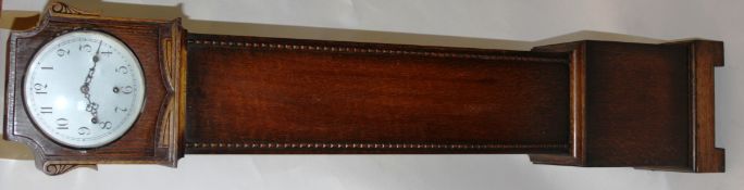 A vintage 1930's Art Deco grand daughter clock in oak case with silvered dial by Enfield Clock Co.