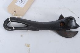 An early 20th century cast iron tin opener in the manner of Prestons being in the shape of a bull