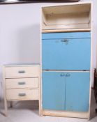 A vintage 1950's two tone kitchen dresser having cupboards and drawers with fall front centre.
