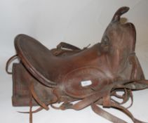 A large late 19th / early 20th century tolled leather horse riding saddle.