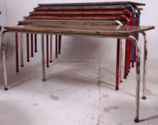 A set of 6 vintage 20th century shabby chic stacking childrens school desks raised on painted