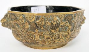 A Chinese heavy brass censur / ding cast in relief with scenes of warriors bearing marks to the