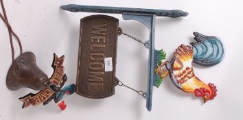 2x Victorian style cast iron large and small welcome signs.