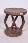 A 19th century ?  Southern African Tribal Shona stool / zulu stool being hand carved with circular