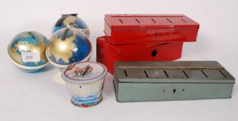 A collection of vintage and retro collectable money boxes to include tin varieties,