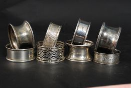 Eight hallmarked napkin rings of various designs and makers 87g gross