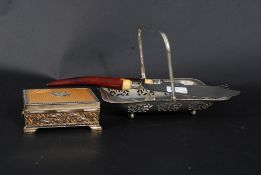 A silver plated fret pierced bob bon dish together with a decorative pair of fish knife and fork