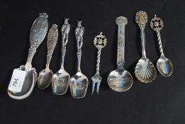 A collection of Norwegian decorative silver spoons marked 40gr / 60 along with two EPNS