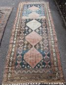 A late 19th century / 20th century hand woven Persian ? rug having blue and black ground