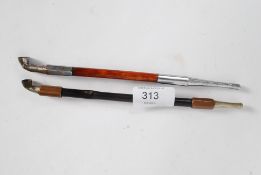 2 20th century opium pipes, one with copper collars,
