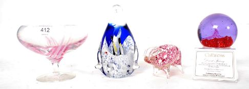 A Caithness Desert Spring paperweight by Alaistair Macintosh together with a studio glass pig,