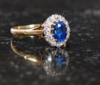 An 18ct gold sapphire and diamond ladies ring. Measures: 3.6g size P.