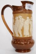 A 19th century Doultons Lambeth stoneware jug of unusual shape with cameo diorama of court figures