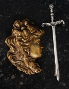 A white metal marked ' silver ' sword brooch,