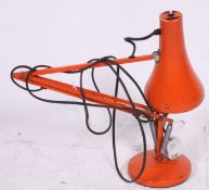 An original vintage retro industrial Herbert Terry anglepoise lamp in vibrant orange colour.