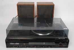 A vintage 1970's Waltham hi-fi centre  to include record deck, tape deck and radio.