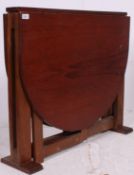 A vintage 1970's retro teak coffee table raised on tapered supports with shaped top above. 74.