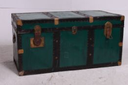 A green 20th century  gilt metal clasp blanket box having hinged top with lined interior.