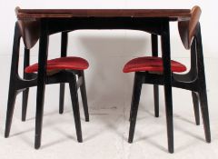 A retro 1960's  G-Plan Tola wood draw leaf dining table refectory raised on ebonised legs along