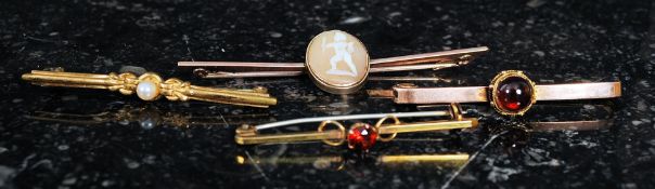 A collection of  9ct gold ladies dress brooches to include cameo set cherub,