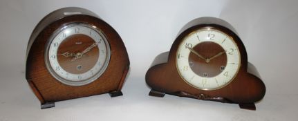 2 1930's Art Deco oak mantel clocks of usual form having silvered dials and dome cases ( see