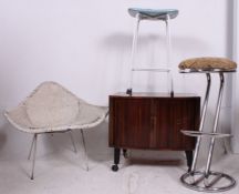 A collection of retro furnishings to include a retro chrome stool, 1970's vinyl upholstered stool,