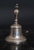 A hallmarked silver small bell. Hallmarks to bell and handle. Measures: 169g.