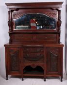 An Edwardian walnut mirror back sideboard.