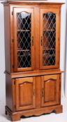A 20th century  contemporary two piece leaded glazed hardwood library bookcase display cabinet.
