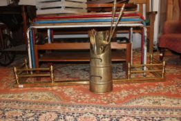 A collection of fireside items to include brass fire fender, fire irons,