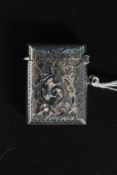 An antique hallmarked silver chase engraved vesta case,