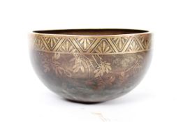 A Chinese brass / bronze ?prayer bowl having  geometric design to the borders with birds and