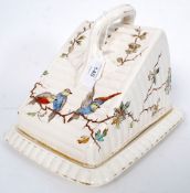 A Victorian German made ceramic transfer print and hand coloured cheese dish with tree like handle.