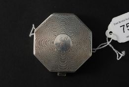 A ladies silver hallmarked octagonal compact bearing hallmarks for John Henry Wynn,