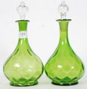 A pair of Victorian / Edwardian hand blown matching green decanters.