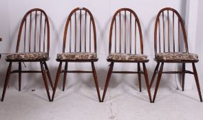 A set of 4 Ercol beech and elm golden dawn Quaker dining chairs raised on tapered legs with